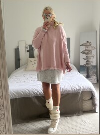 Pull col roulé frange rose